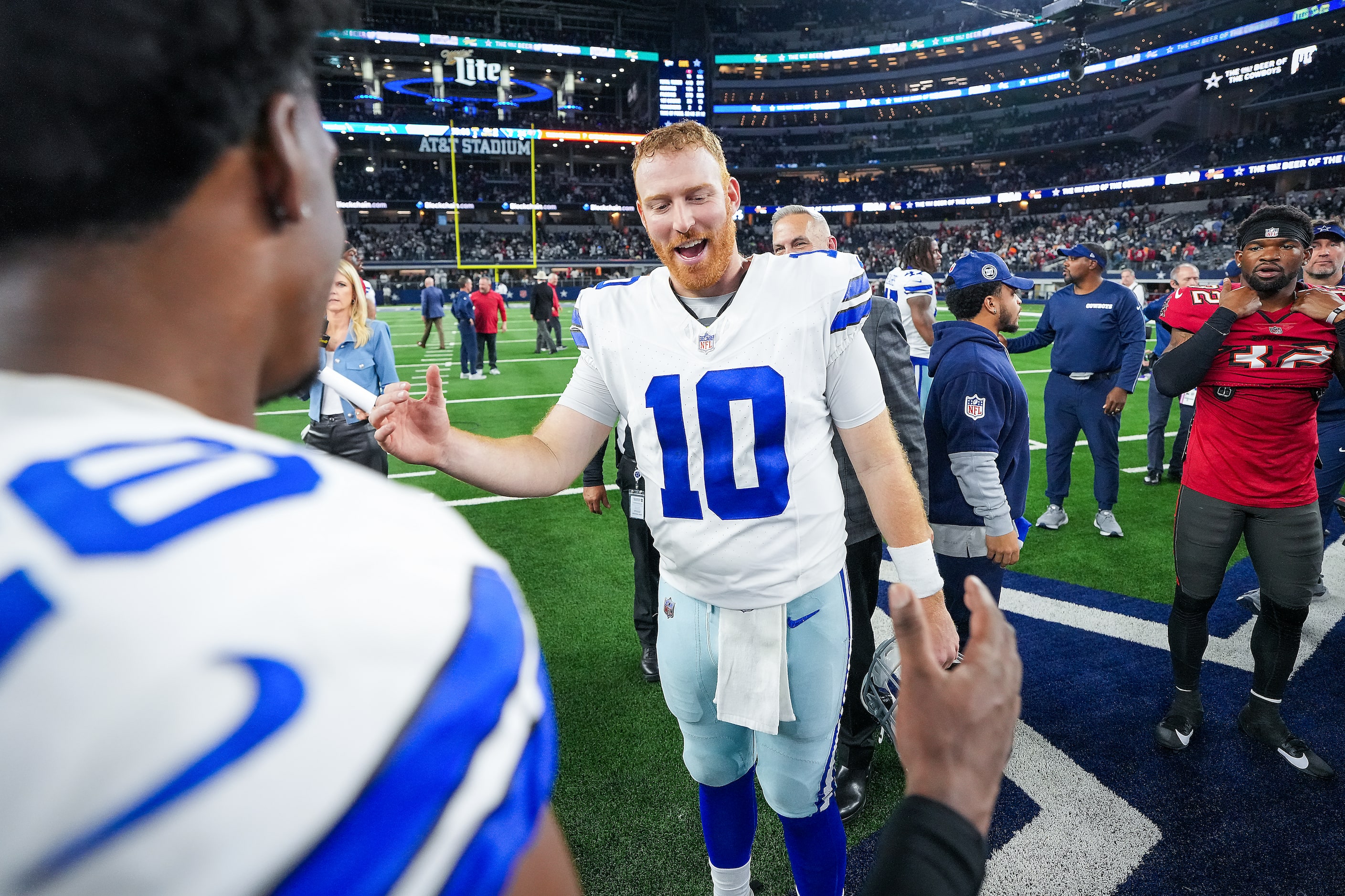 Dallas Cowboys quarterback Cooper Rush (10) celebrates with cornerback DaRon Bland (26)...