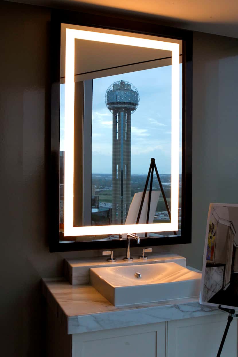 Reunion Tower is reflected in the bathroom mirror in the Presidential Suite at the Omni...