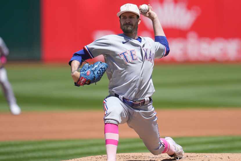 Texas Rangers pitcher Andrew Heaney works against the Oakland Athletics during the first...