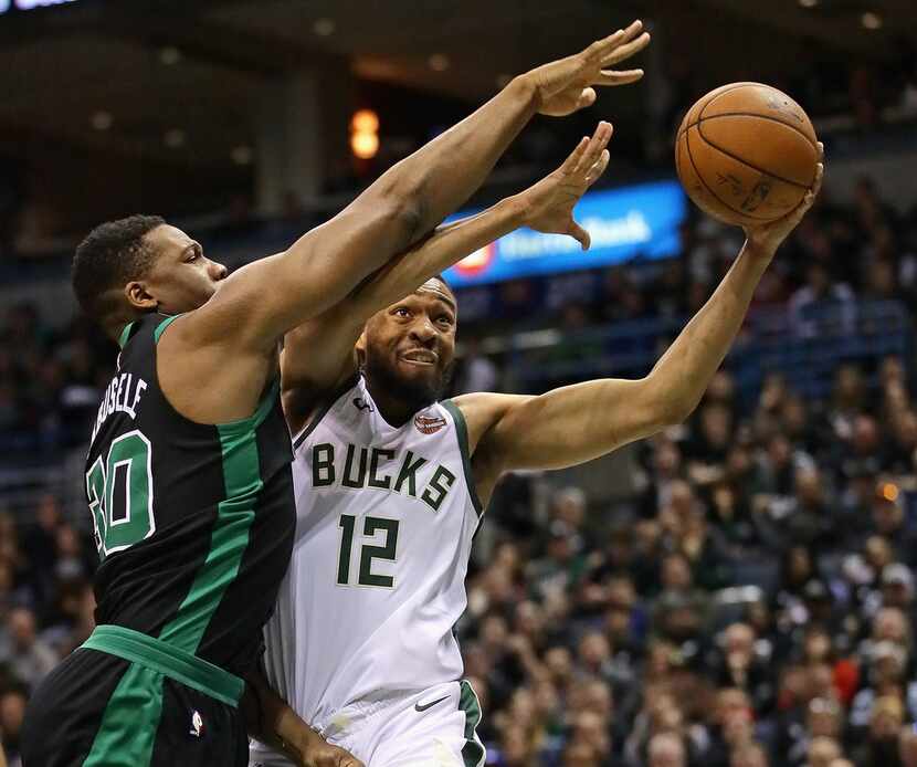 MILWAUKEE, WI - APRIL 22:   Jabari Parker #12 of the Milwaukee Bucks drives against...