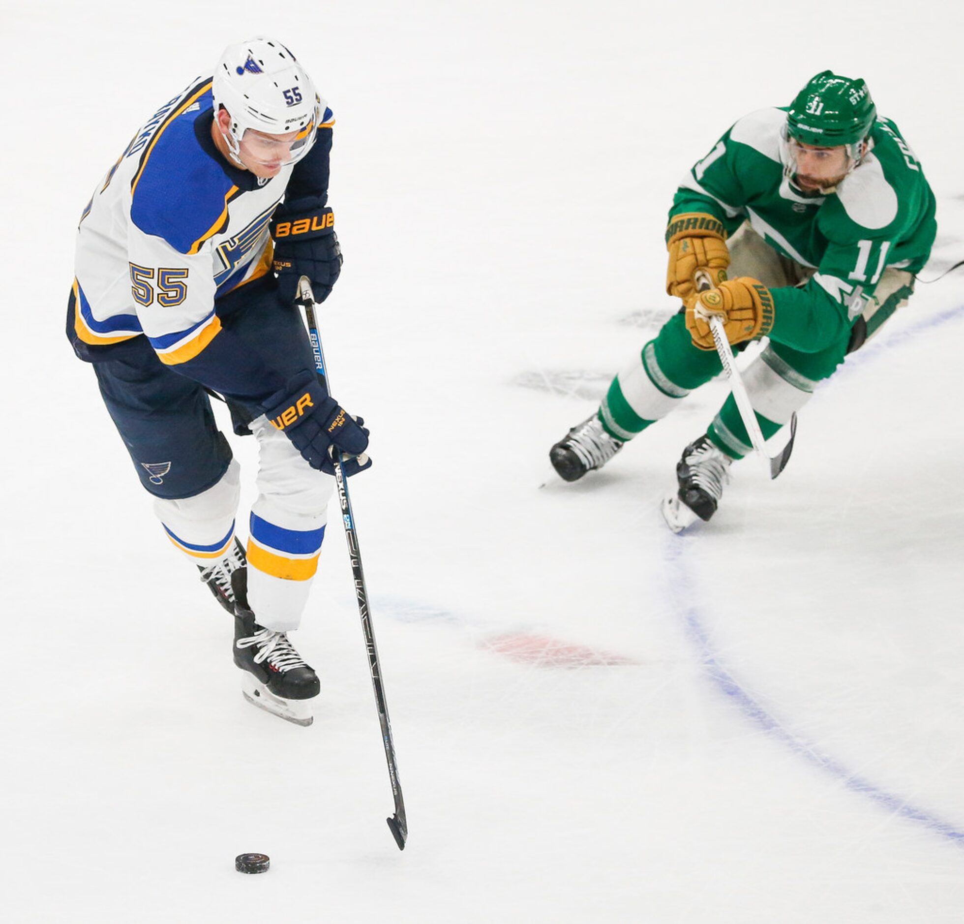 St. Louis Blues defenseman Colton Parayko (55) works past Dallas Stars center Andrew...