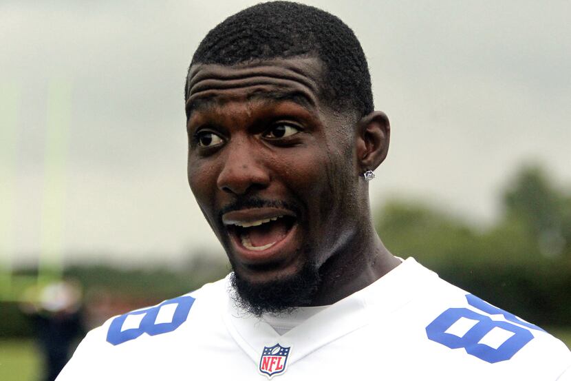 Dallas Cowboys receiver Dez Bryant reacts to the action as he helps coach the winning squad...