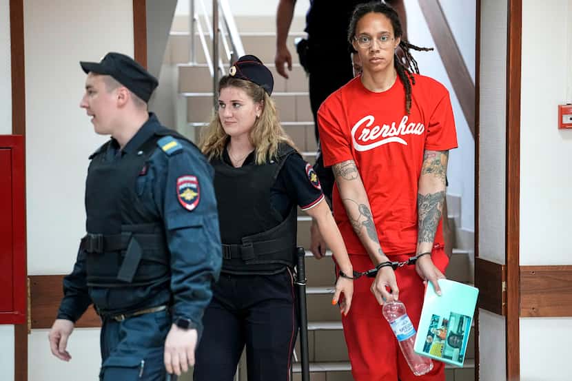 FILE - WNBA star and two-time Olympic gold medalist Brittney Griner is escorted to a...