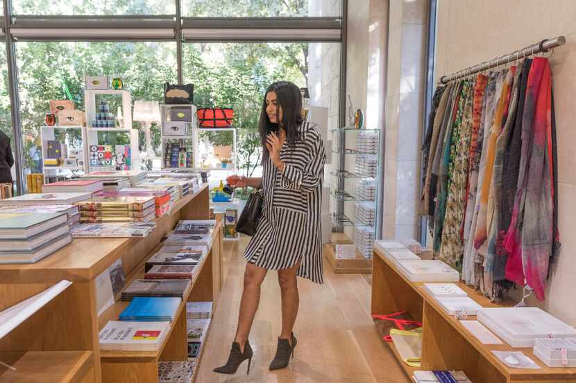 Krystal Sarna looks at items for sale at the revamped Nasher Store 