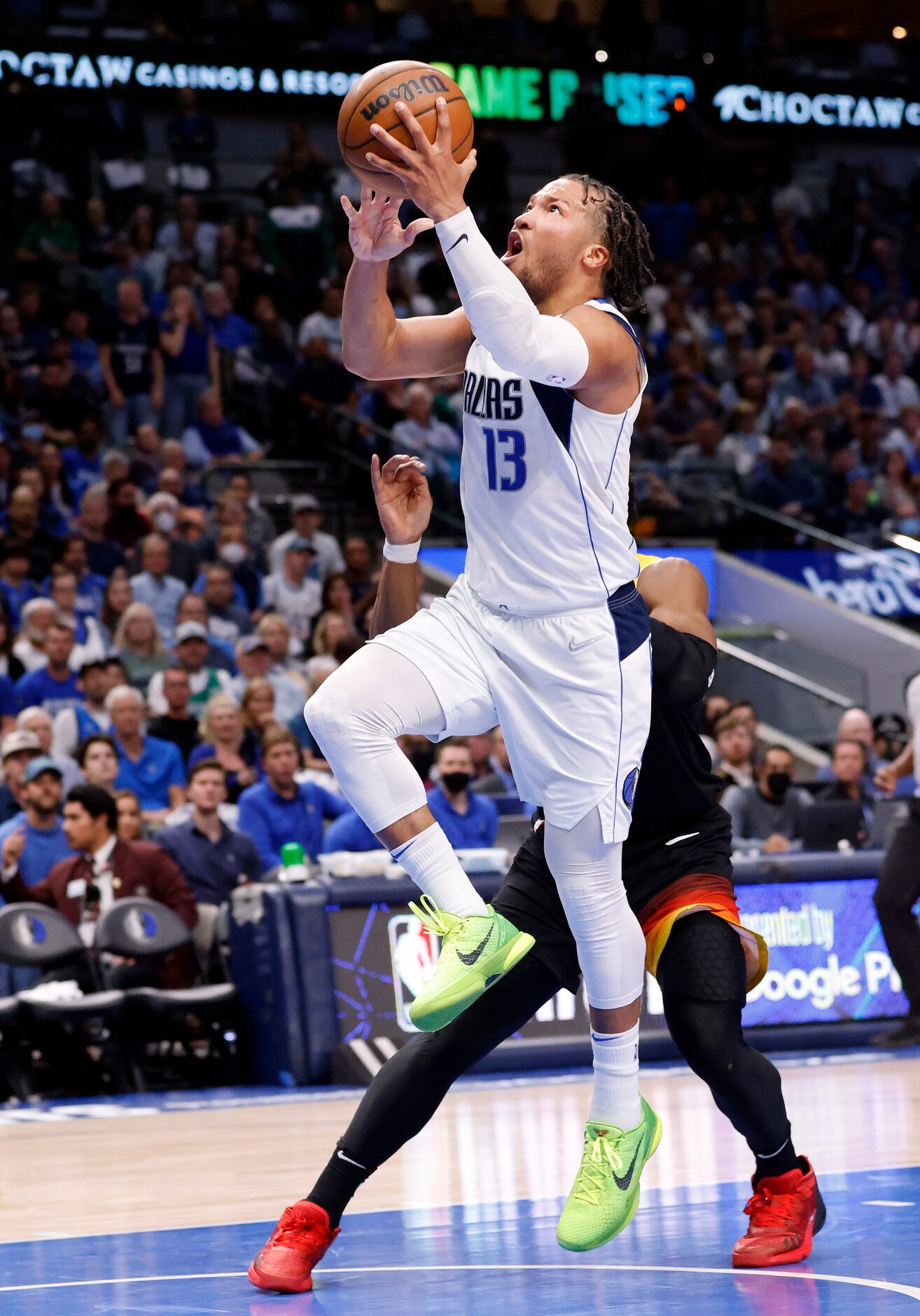 Dallas Mavericks guard Jalen Brunson (13) drives the lane for a third quarter layup against...