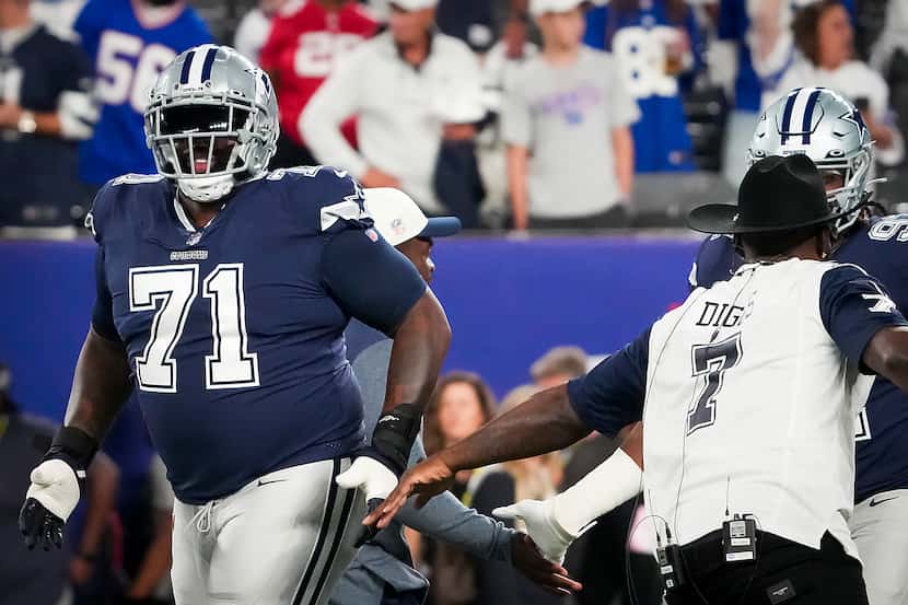 Dallas Cowboys offensive tackle Jason Peters (71) slaps hands with former Cowboys wide...