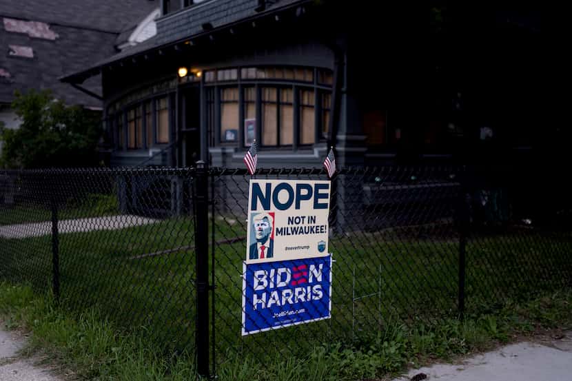 Campaign signs are posted on a fence in Milwaukee, Saturday, July 13, 2024. Milwaukee loves...