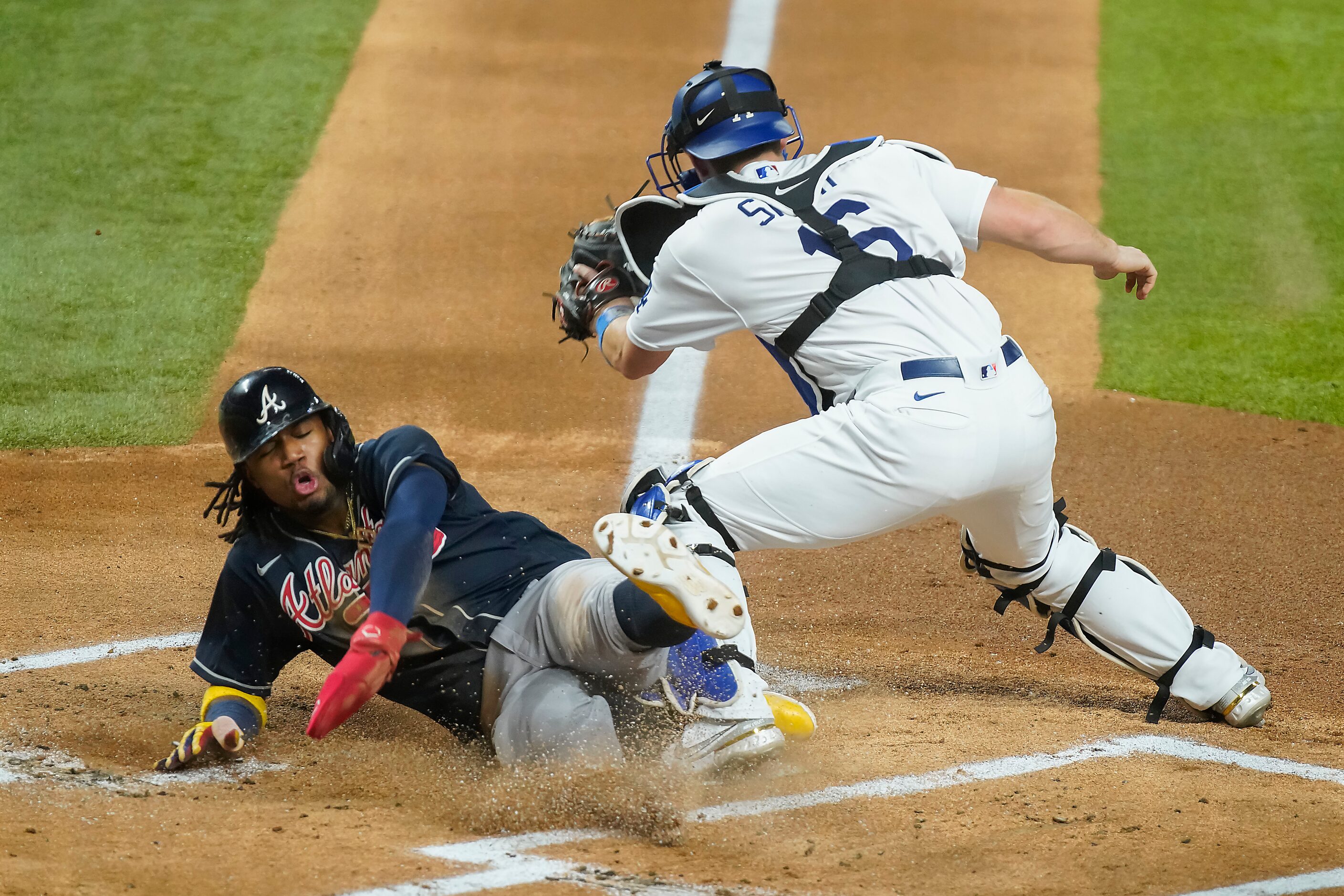 Atlanta Braves right fielder Ronald Acuna Jr. (13) scores on a single by designated hitter...