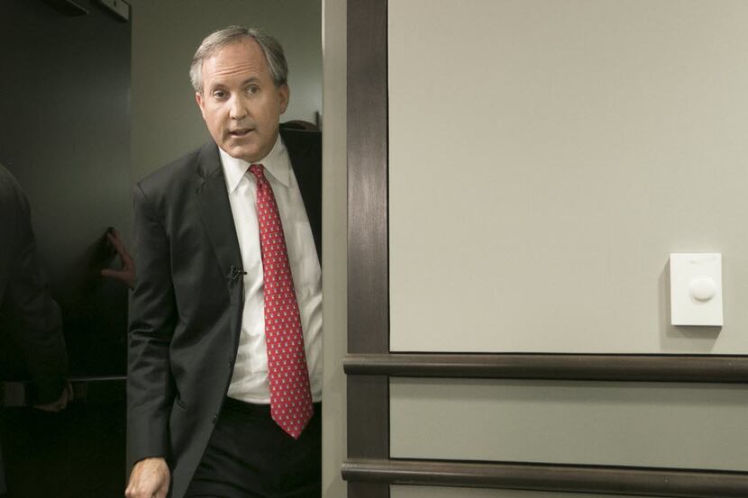 Texas Attorney General Ken Paxton, shown here at a May 2016 news conference, is facing...