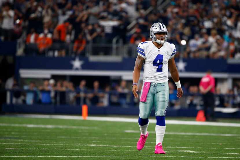 Dallas Cowboys quarterback Dak Prescott (4) walks up to the line of scrimmage during an NFL...