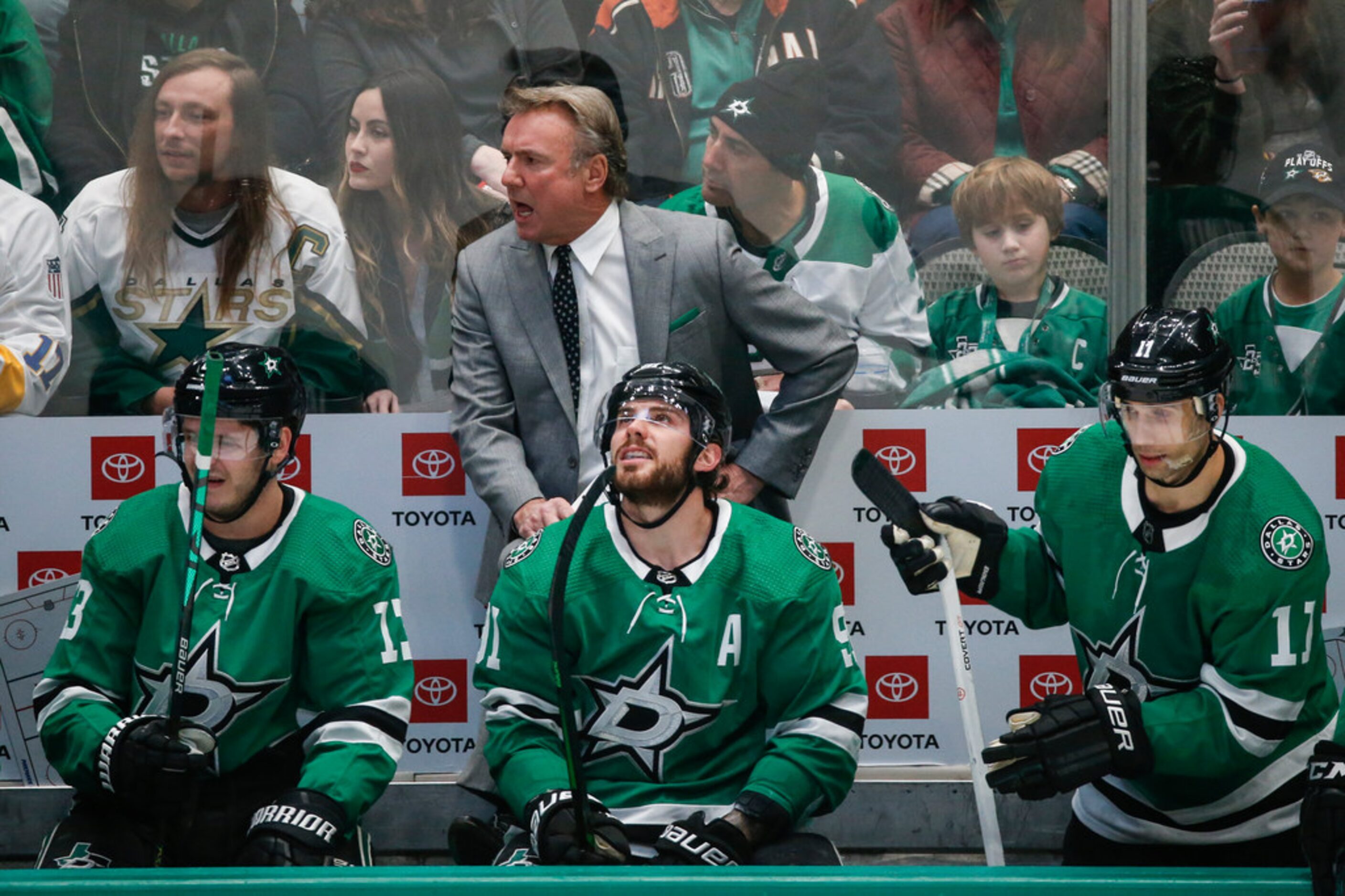 Dallas Stars interim head coach Rick Bowness works the bench during the first period of a...