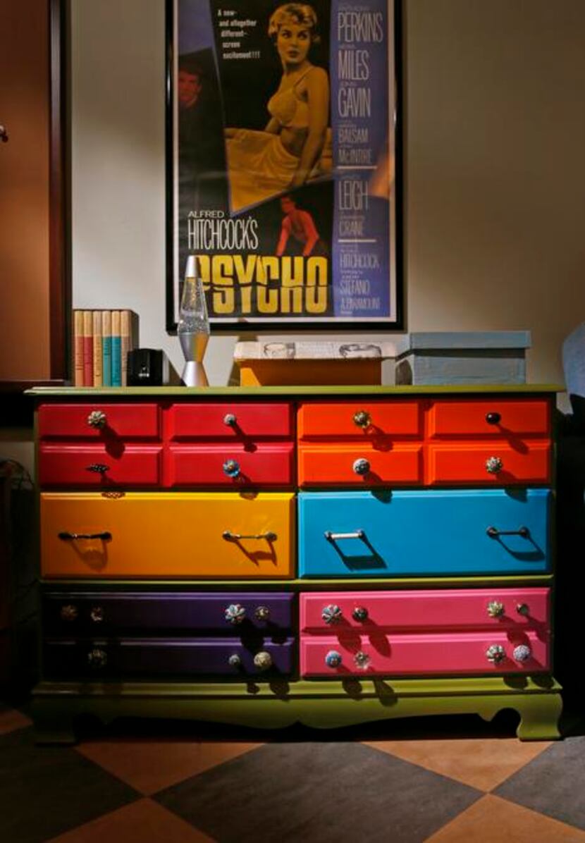 
Colorful drawers with vintage pulls and a Psycho poster contribute to the classroom’s...