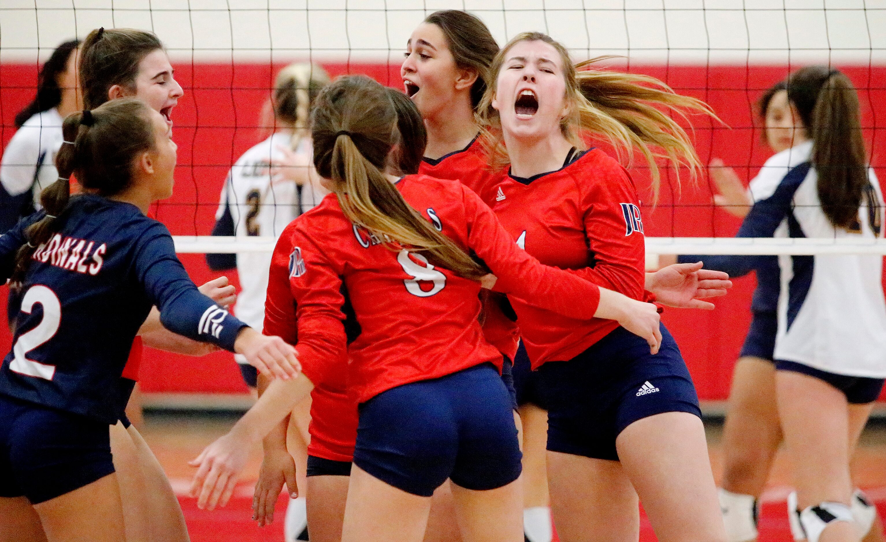 John Paul II High School outside hitter Hamilton Greene (4) celebrates a point in the first...