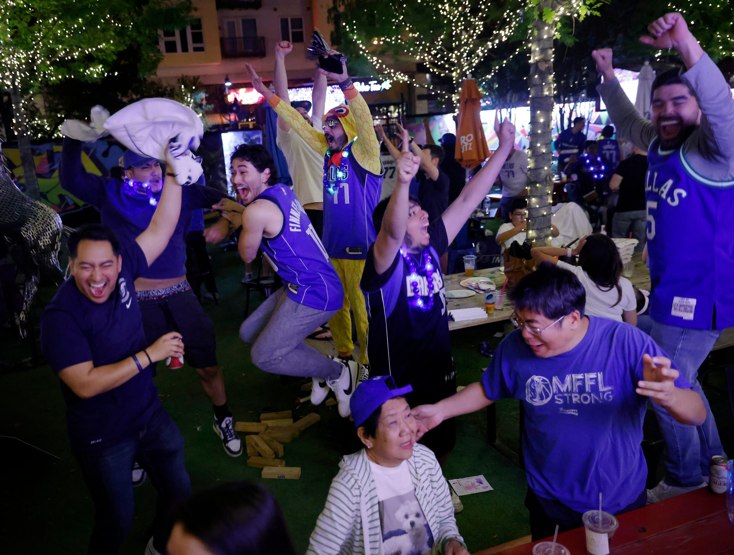 Dallas Mavericks fans celebrate the series win over the Utah Jazz during a Game 6 watch...