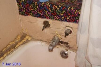  The bathtub in Galvin Martin's house along East Clarendon has seen better days.(City of...