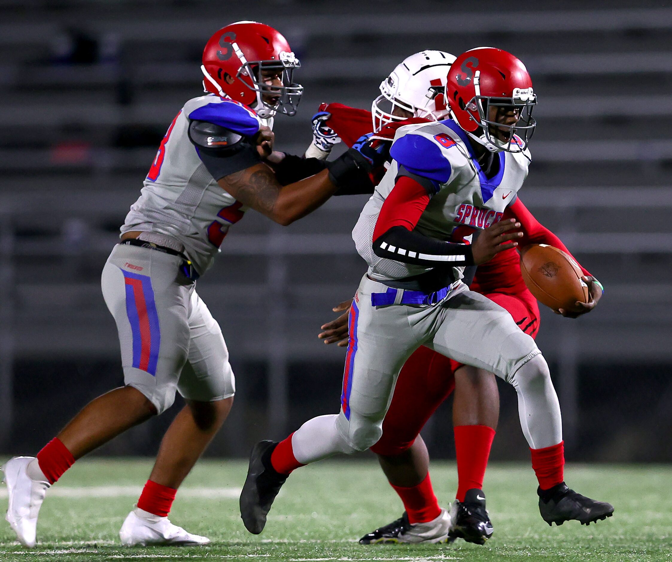 Spruce quarterback Kelvin Jones (8) has a nice lane to run against Hillcrest during the...