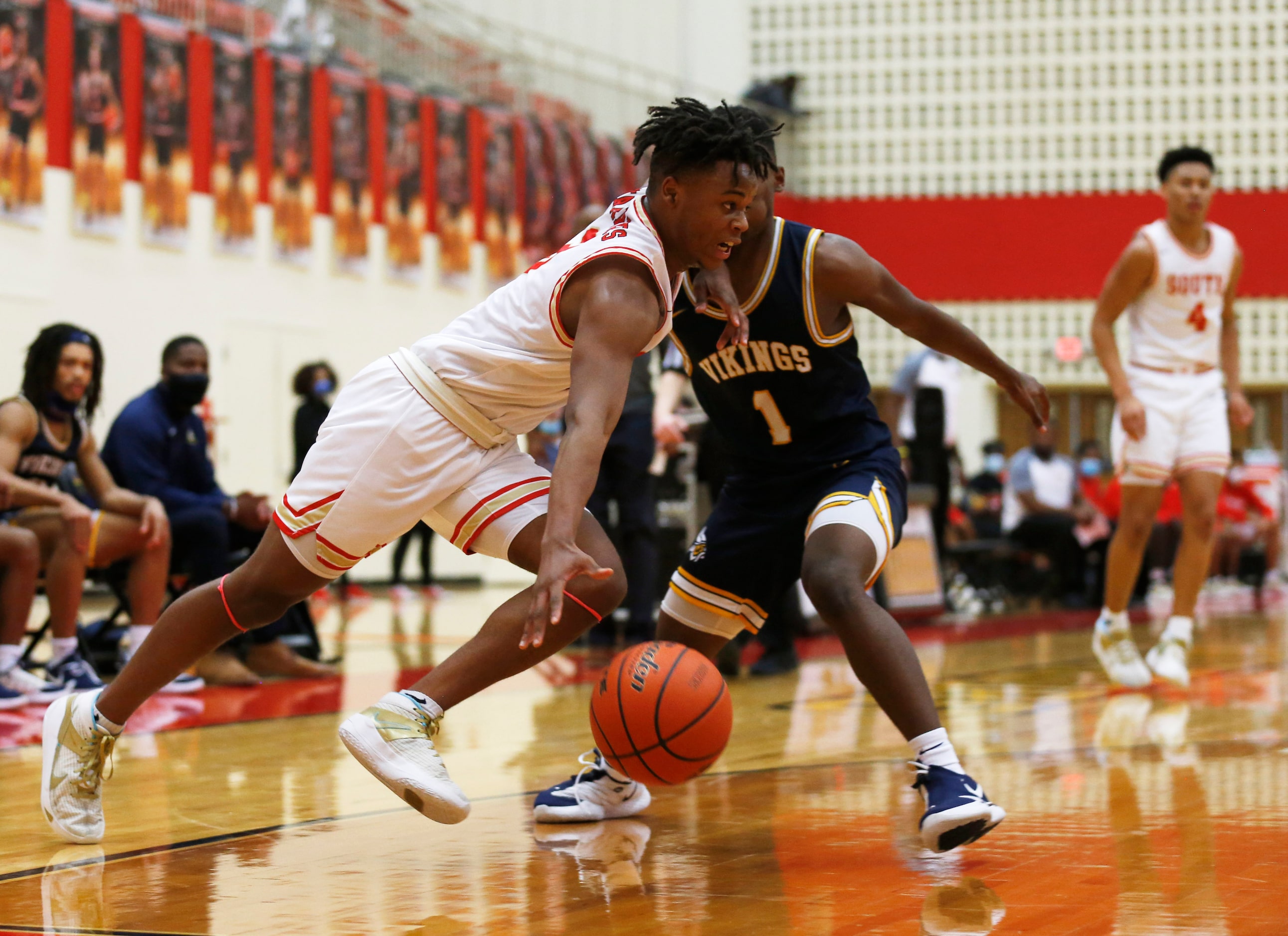 South Grand Prairie's Anthony Solomon (3) drives past  Arlington Lamar's Jalen Ware-Williams...