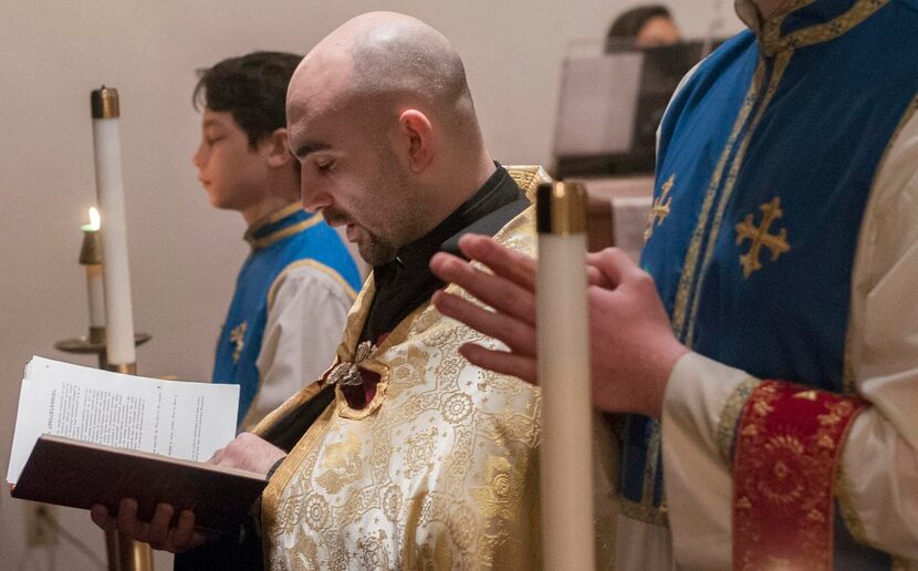 
Father Ghevond Ajamian (center) conducts a service at St. Sarkis Armenian Orthodox Church.
