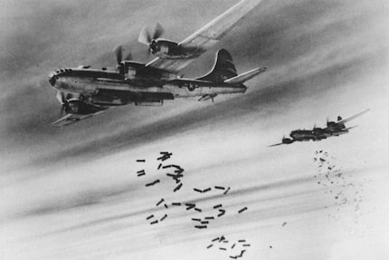 Bombs are released from two U.S. Air Force B-29 Superfortresses bombers over Burma during...