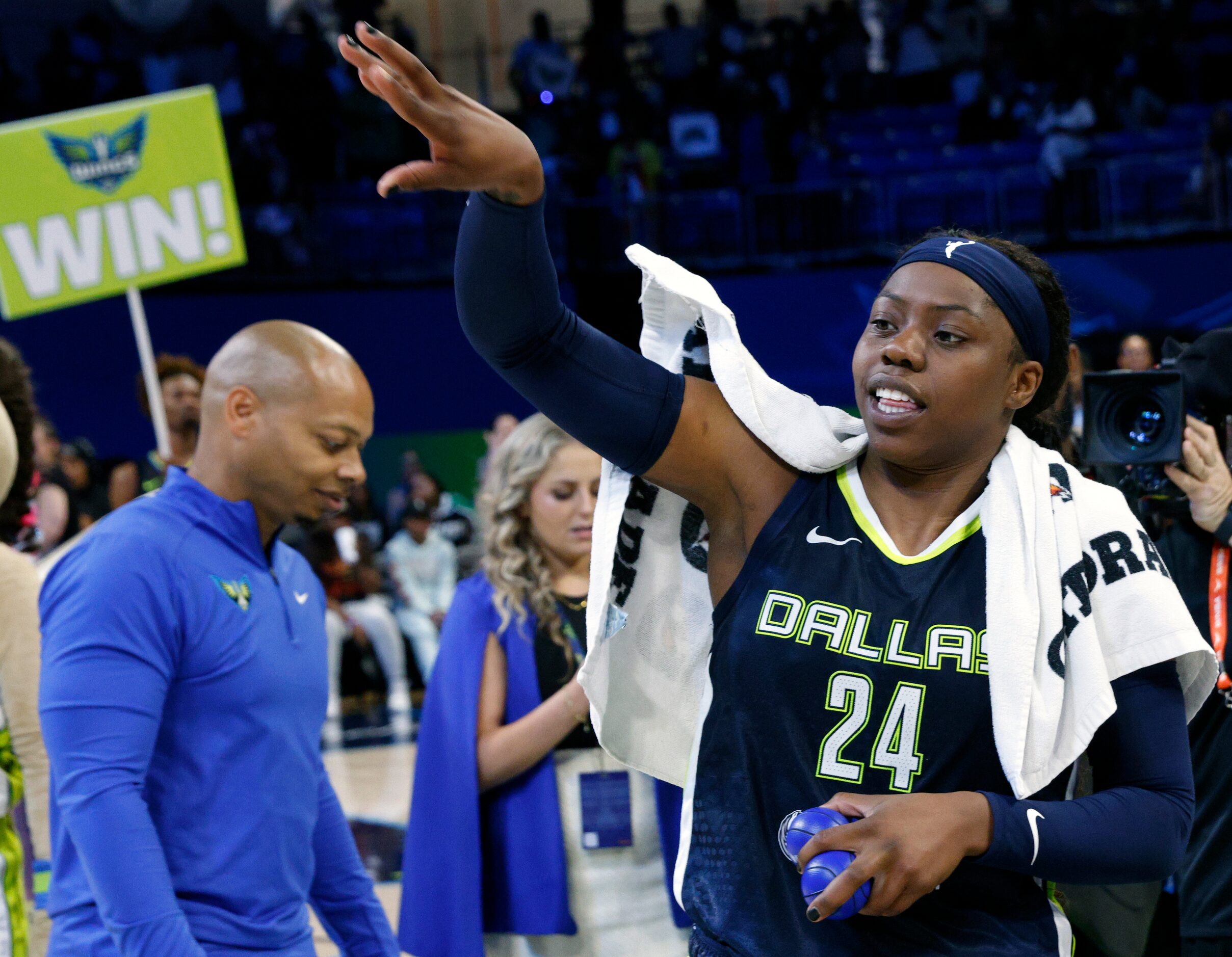 Dallas Wings guard Arike Ogunbowale (24) tosses a ball to the crowd after a WNBA first-round...