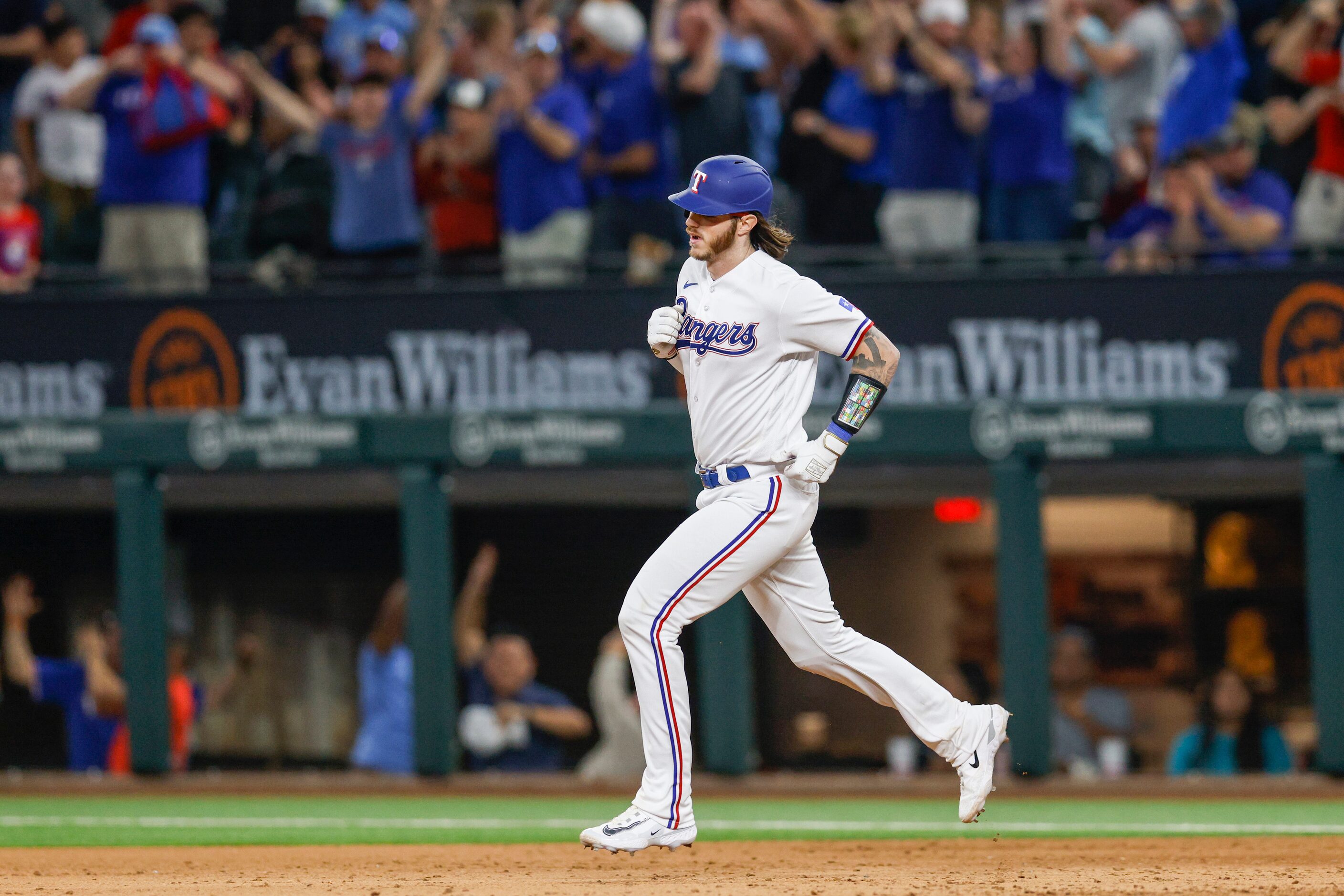 Texas Rangers catcher Jonah Heim (28) rounds the bases after hitting a three-run walk-off...