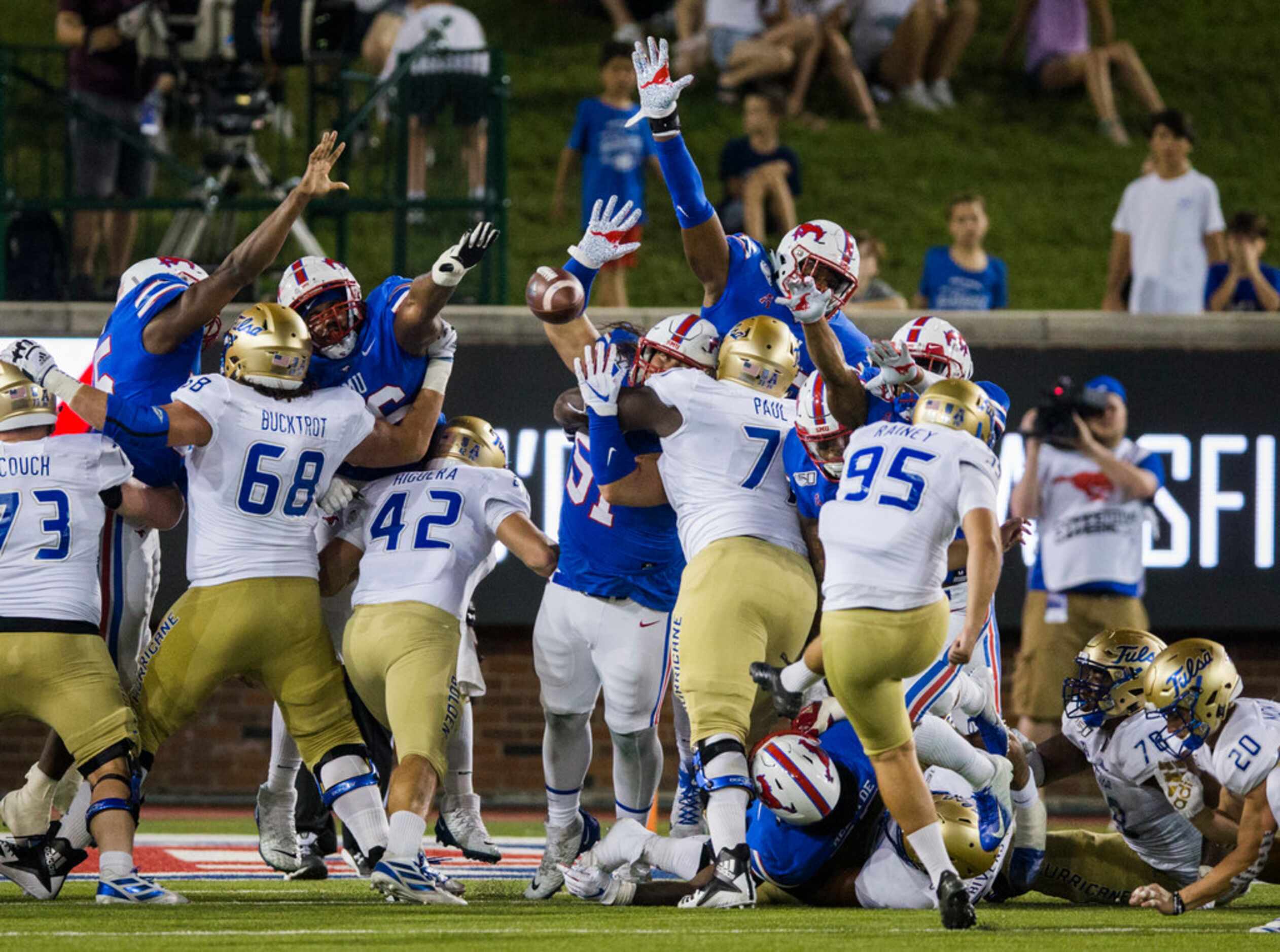 An extra point attempt by Tulsa Golden Hurricane place kicker Jacob Rainey (95) during the...