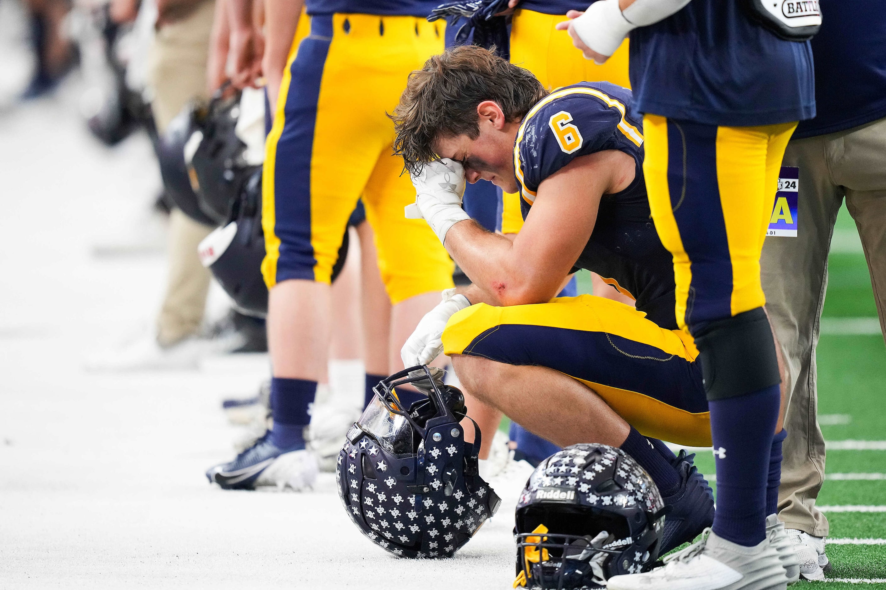 Highland Park's Anders Corn (6) waits in line with his teammates to be presented with the...