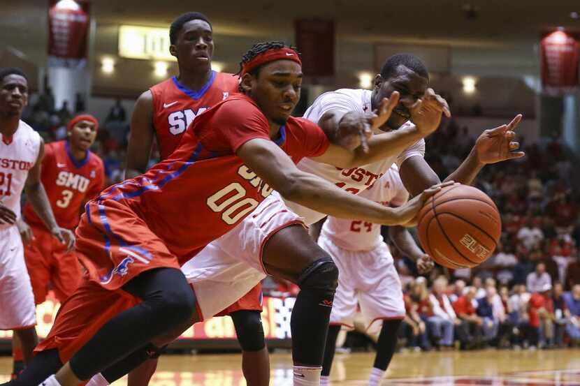 Feb 1, 2016; Houston, TX, USA; Southern Methodist Mustangs forward Ben Moore (00) chases a...