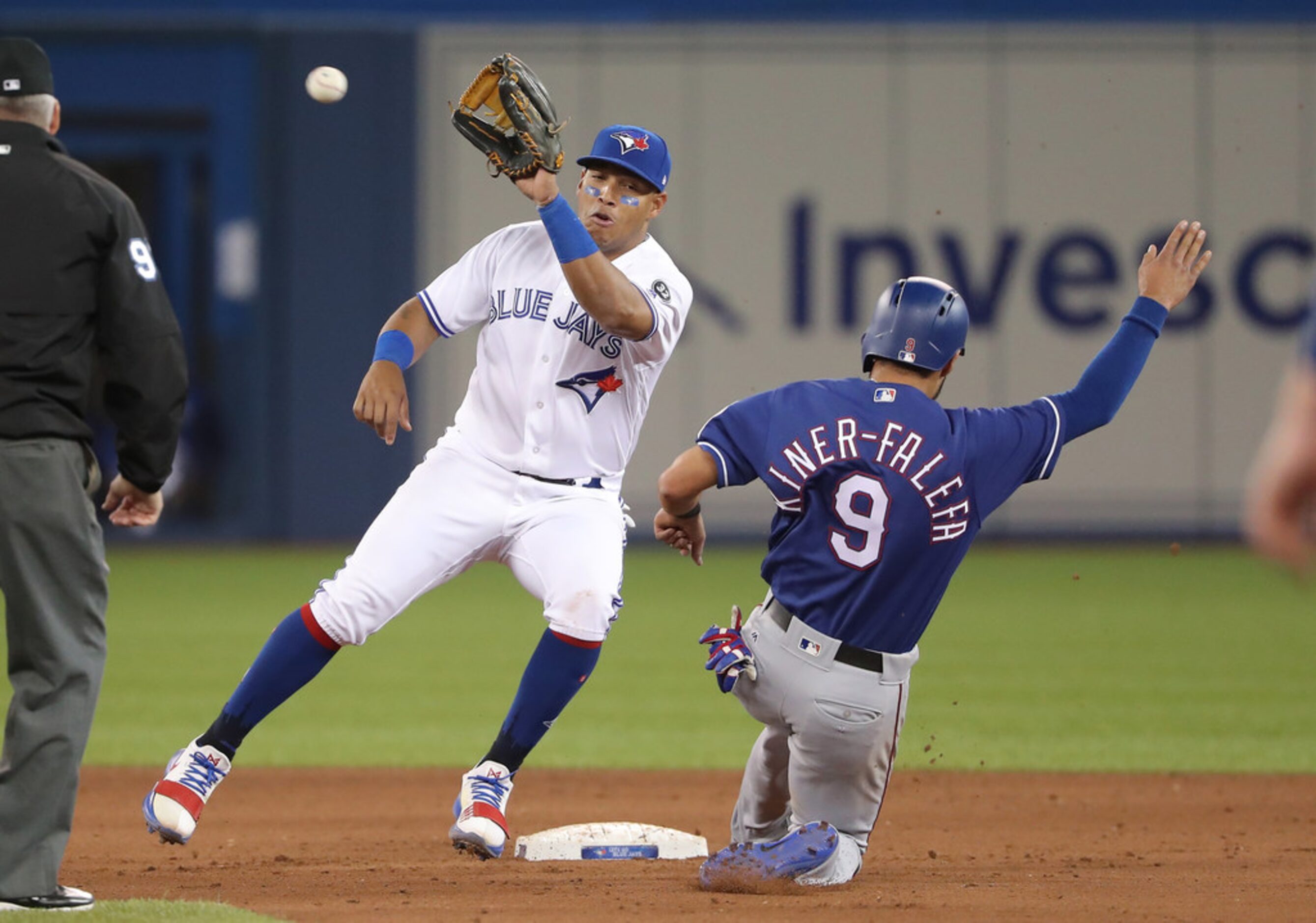 TORONTO, ON - APRIL 27: Isiah Kiner-Falefa #9 of the Texas Rangers is caught stealing in the...