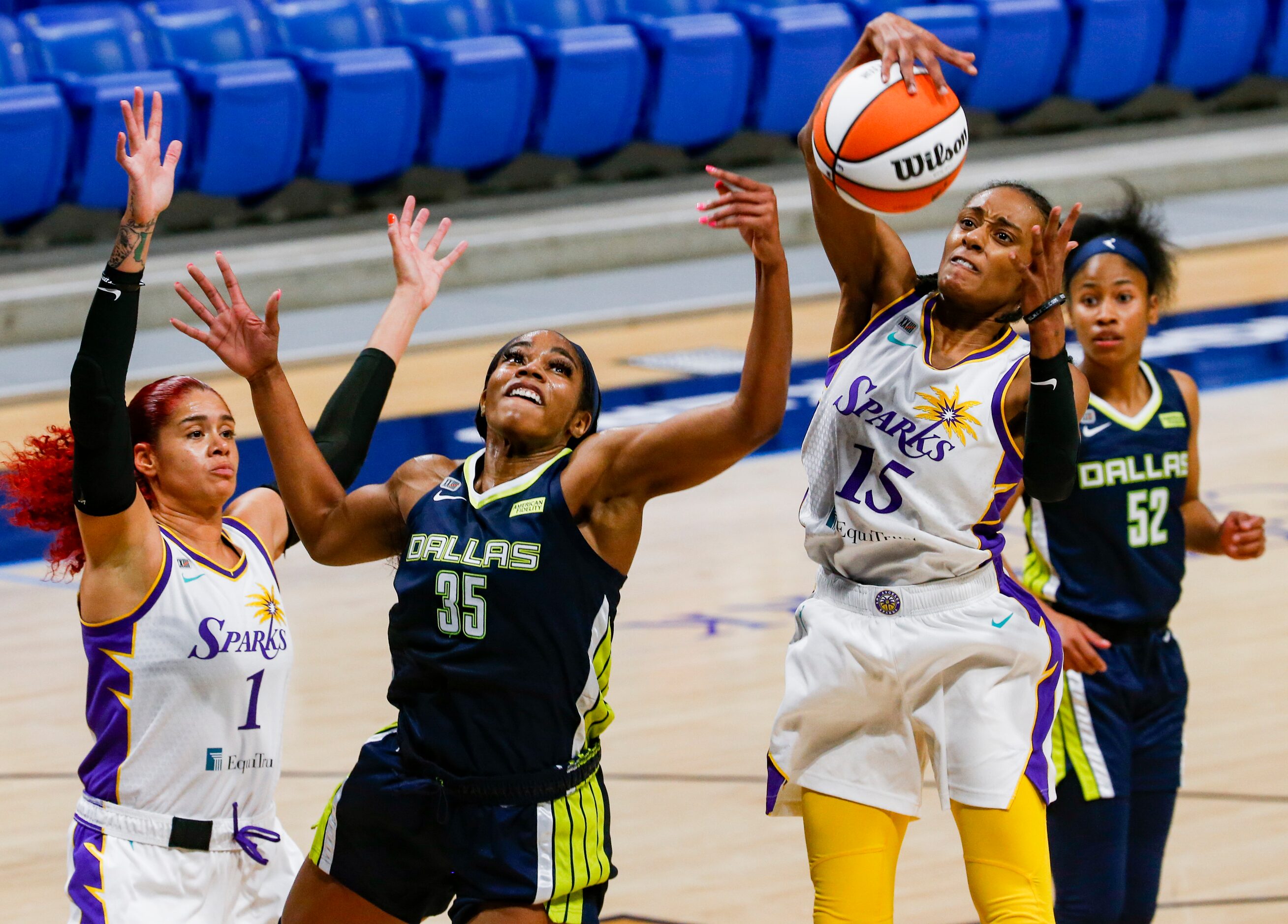 Dallas Wings forward/center Charli Collier (35) tries to get the ball from Los Angeles...