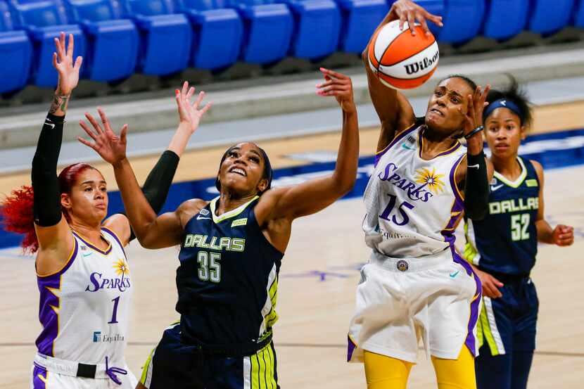 Dallas Wings forward/center Charli Collier (35) tries to get the ball from Los Angeles...