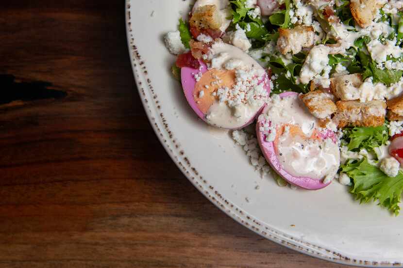 Purple pickled eggs for TCU are served with the Cobb salad as a way to honor owner Maurice...