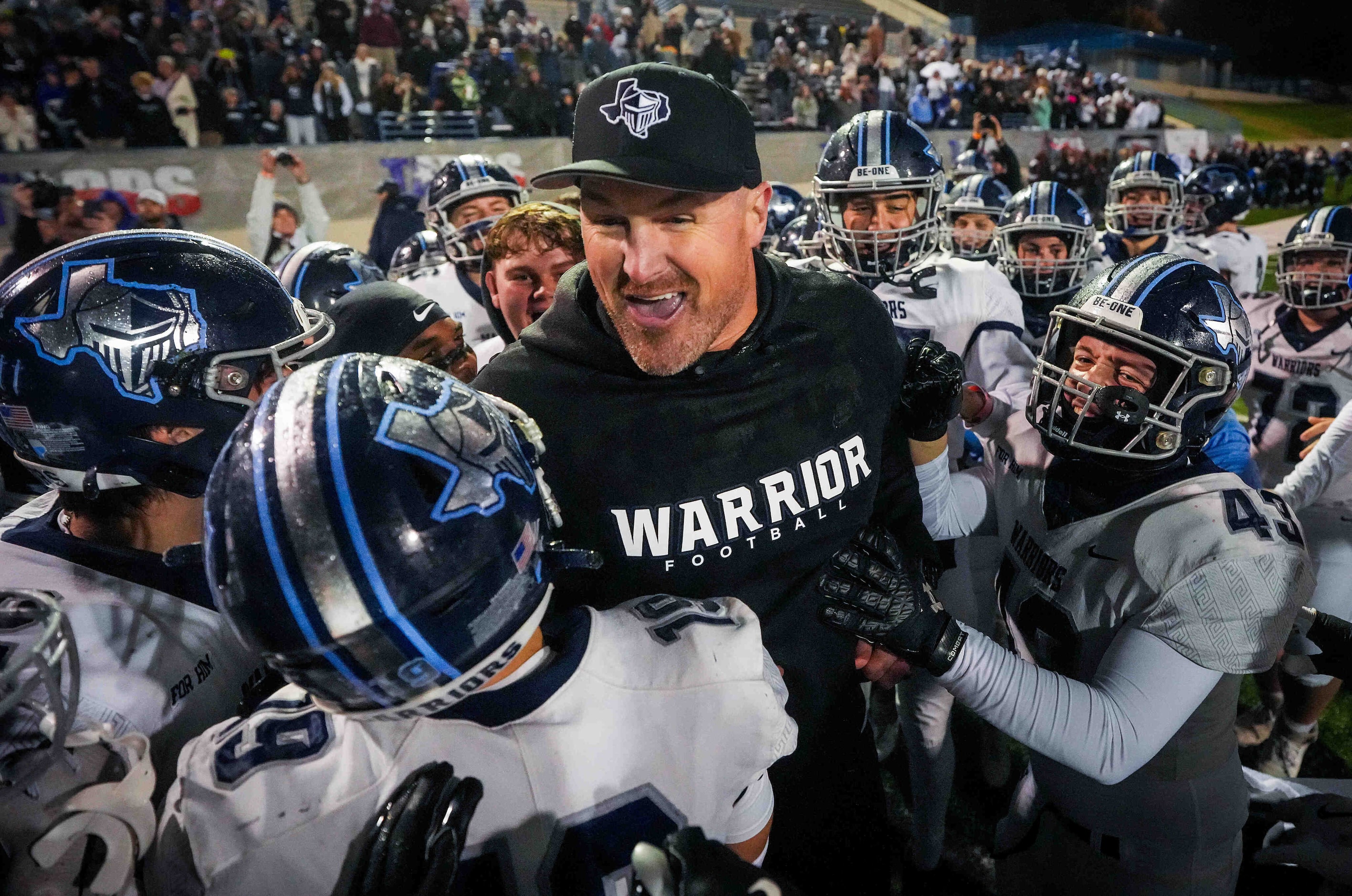 Argyle Liberty Christian head coach Jason Witten celebrates with his players after a 45-24...