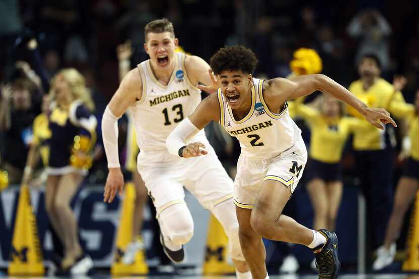 WICHITA, KS - MARCH 17:  Jordan Poole #2 and Moritz Wagner #13 of the Michigan Wolverines...