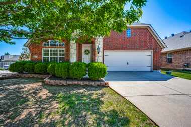 The home at 5701 Balmorhea Drive in Denton’s Country Lakes North neighborhood has three...