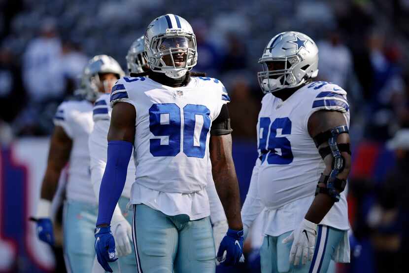 Dallas Cowboys defensive end Demarcus Lawrence (90) and defensive tackle Neville Gallimore...