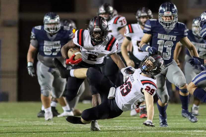 Lake Highlands running back Noelle Whitehead (2) collides with wide receiver Ryan Lucas (29)...