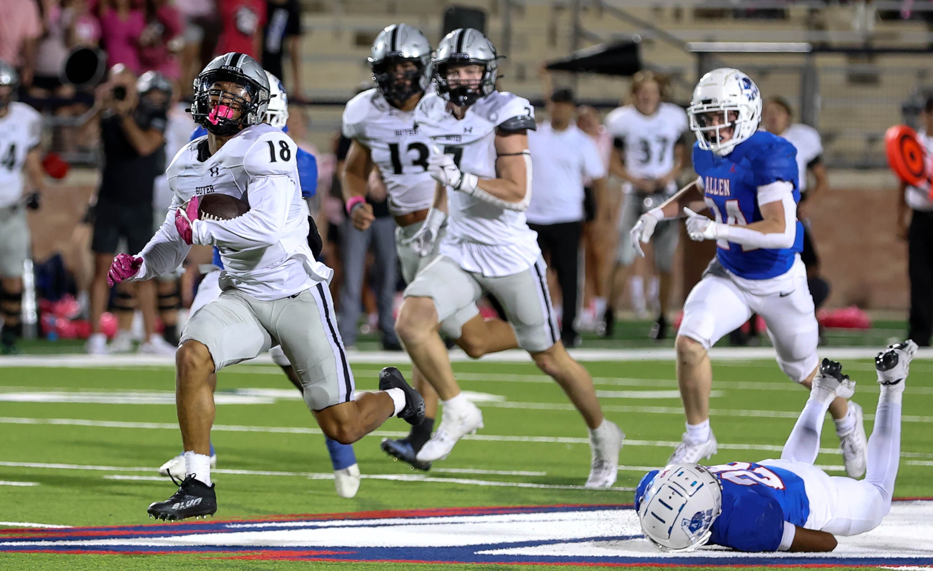 Denton Guyer punt returner Eli Bowen (18) goes all the way for a touchdown against Allen...