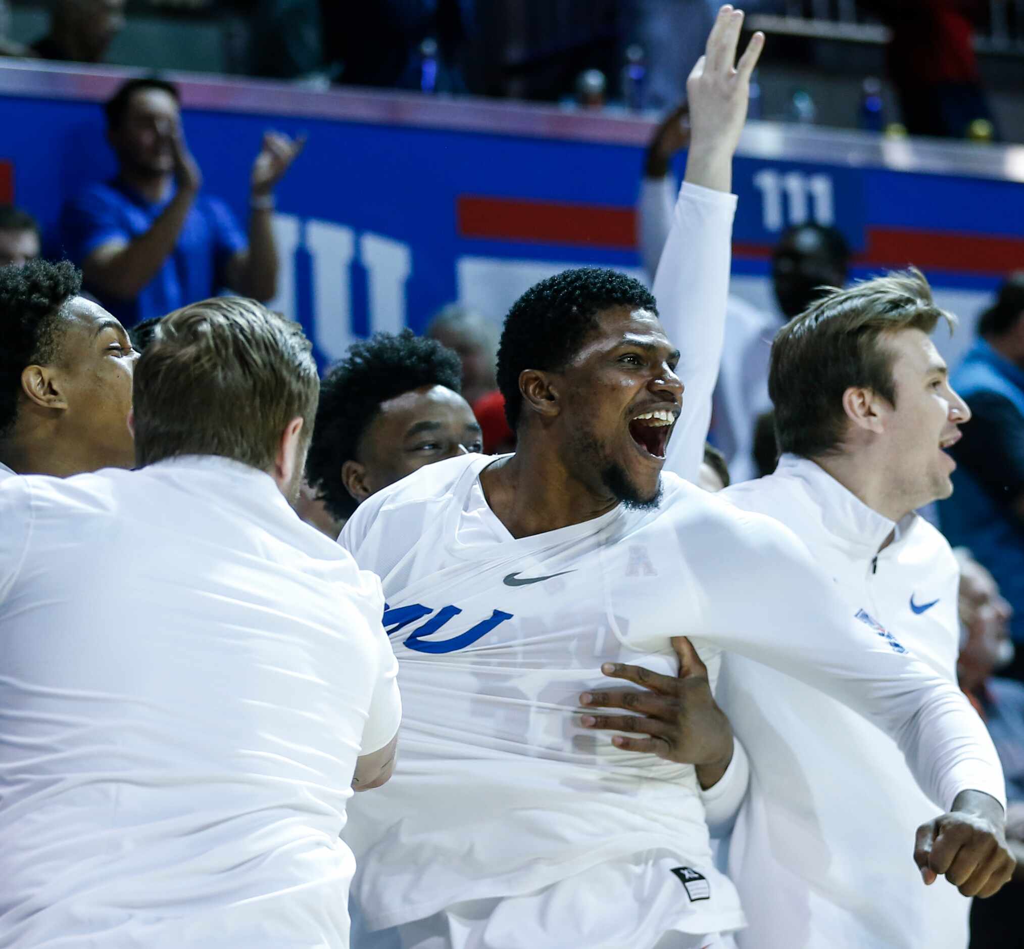 Southern Methodist Mustangs forward Franklin Agunanne (33) cheers as his teammate scores...