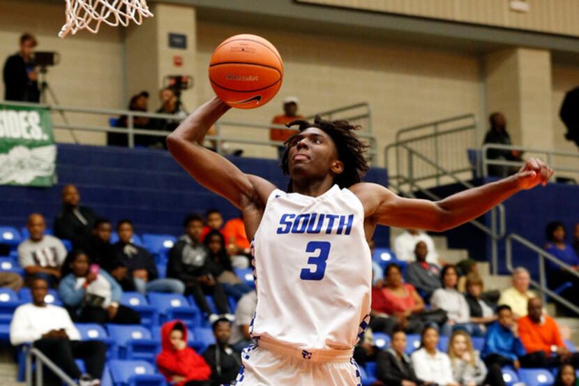South Garland's Tyrese Maxey (3) prepares to dunk the ball against Silsbee during their high...
