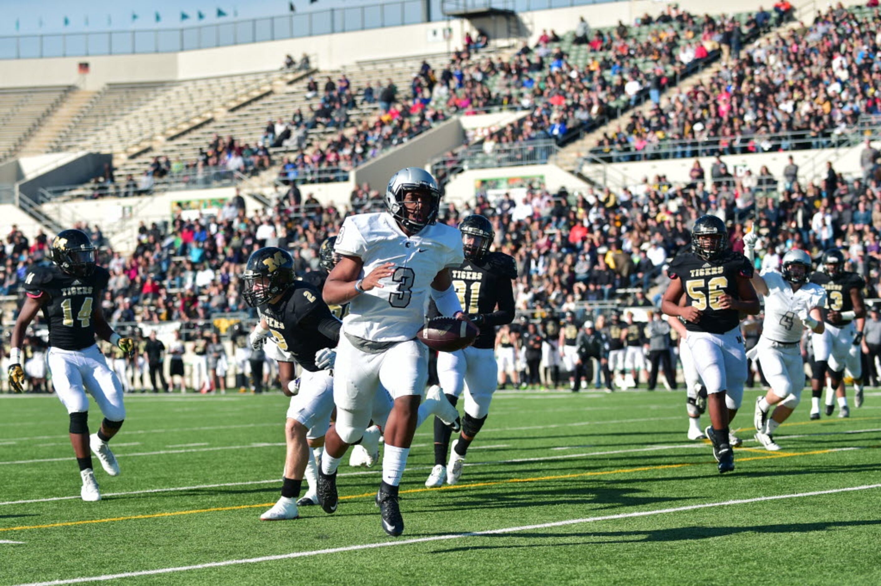 Guyer junior quarterback Shawn Robinson (3) finds open space to run for a touchdown against...