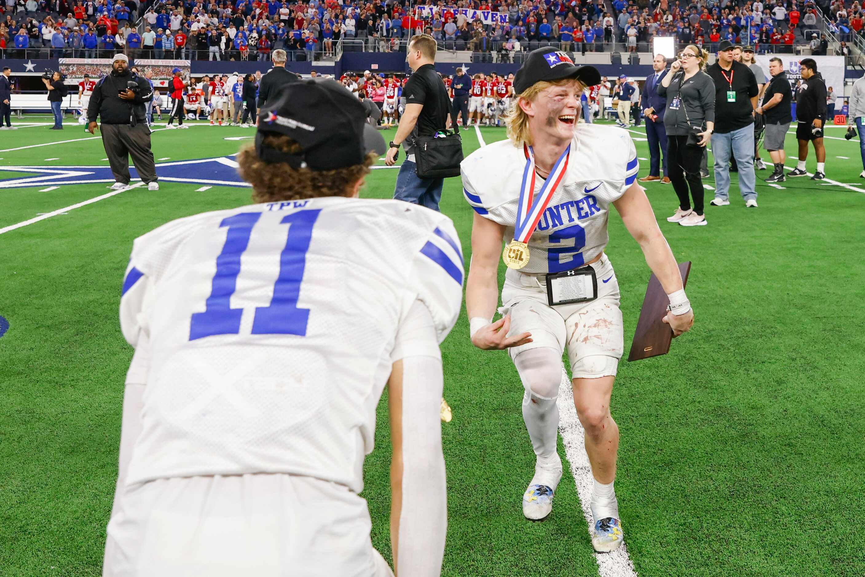 Gunter High’s Brock Boddie (left) and QB Walker Overman celebrate after Overman becomes the...