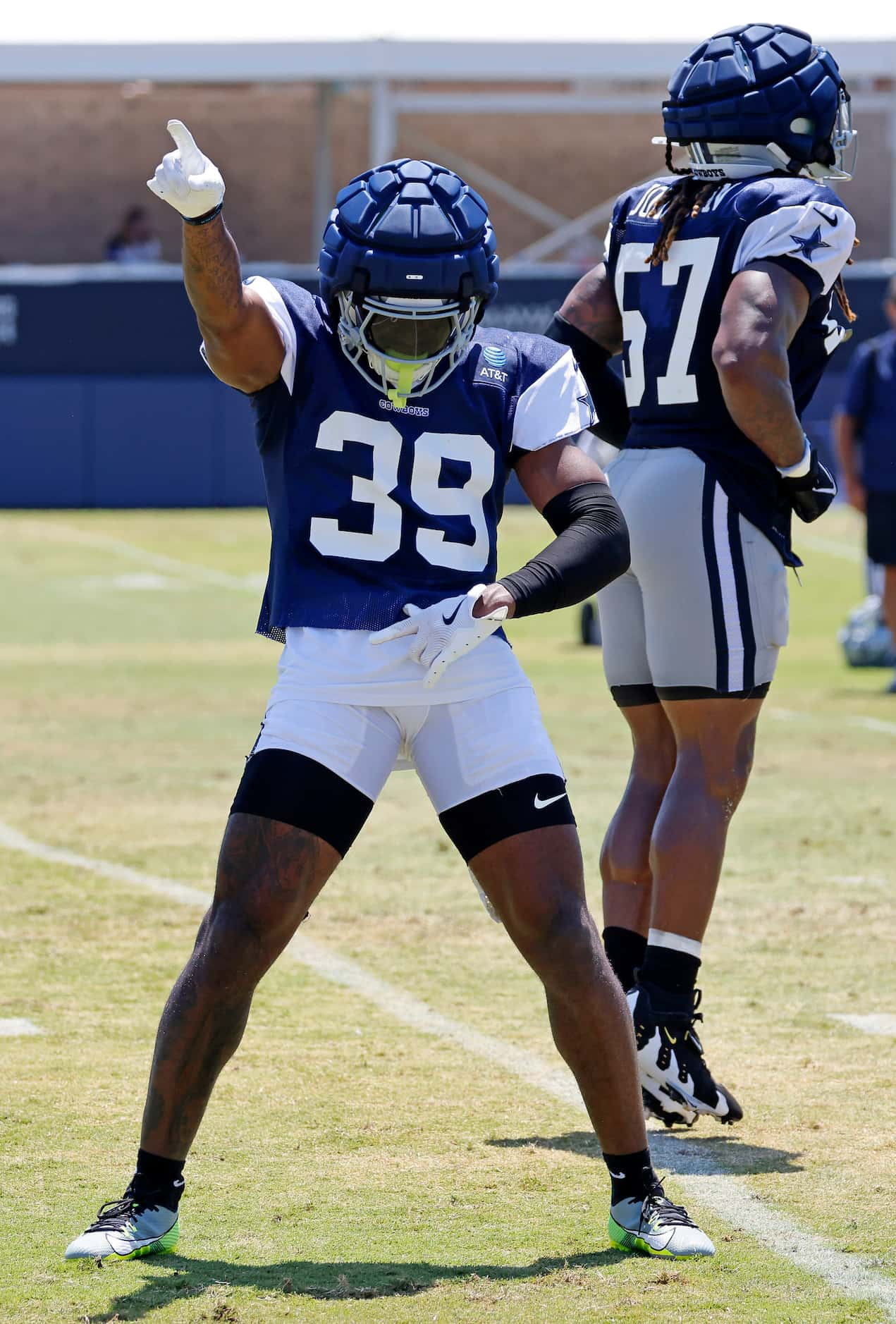 Dallas Cowboys safety Emany Johnson (39) does a little dance after he helped break up a pass...