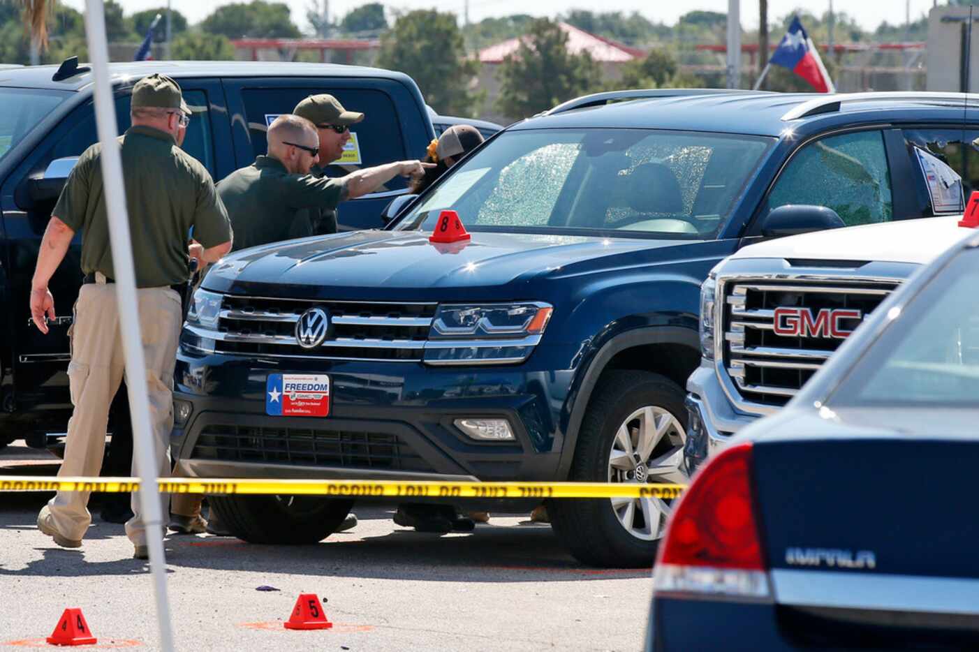 Officials continue to work the scene, Monday, Sept. 2, 2019, in Odessa, Texas, where...