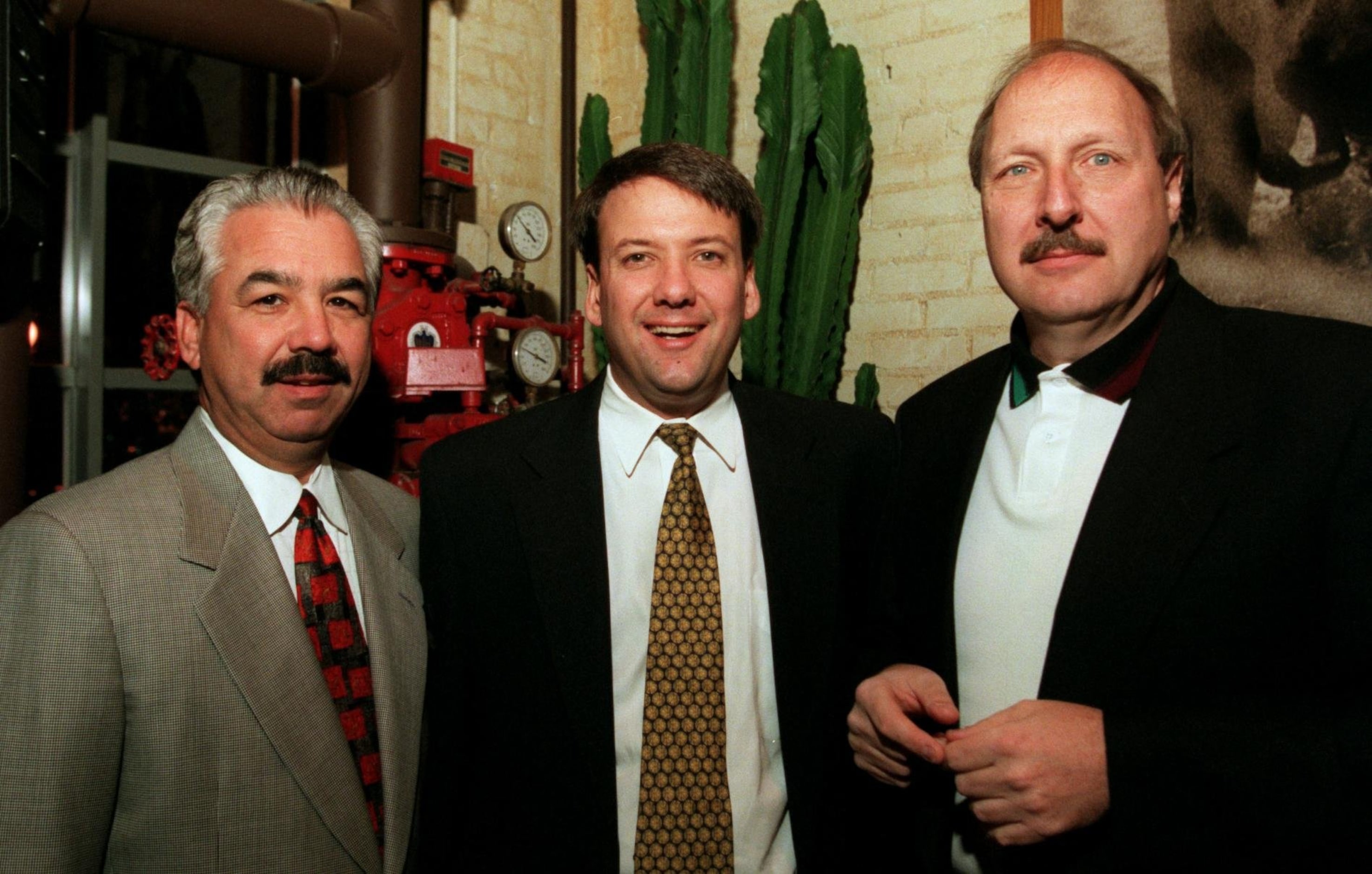 Joe Alcantar, left, Ken Luce, center, Norm Hitzges, right, share a moment during Temerlin...