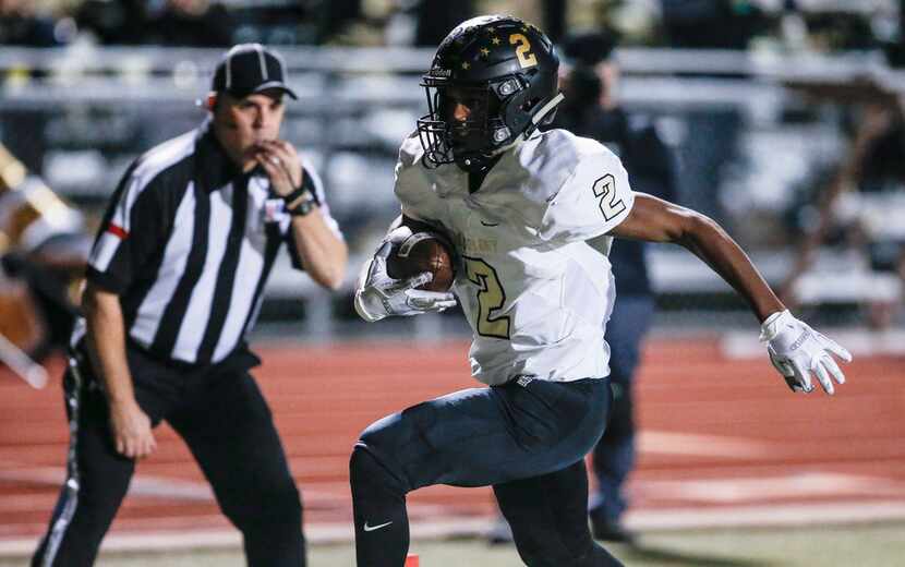 FILE - The Colony junior running back Myles Price (2) carries a pass for a touchdown as...