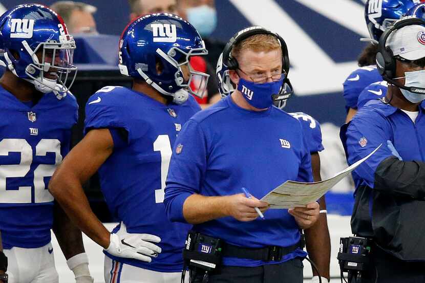New York Giants offensive coordinator Jason Garrett calls the plays from the sidelines...