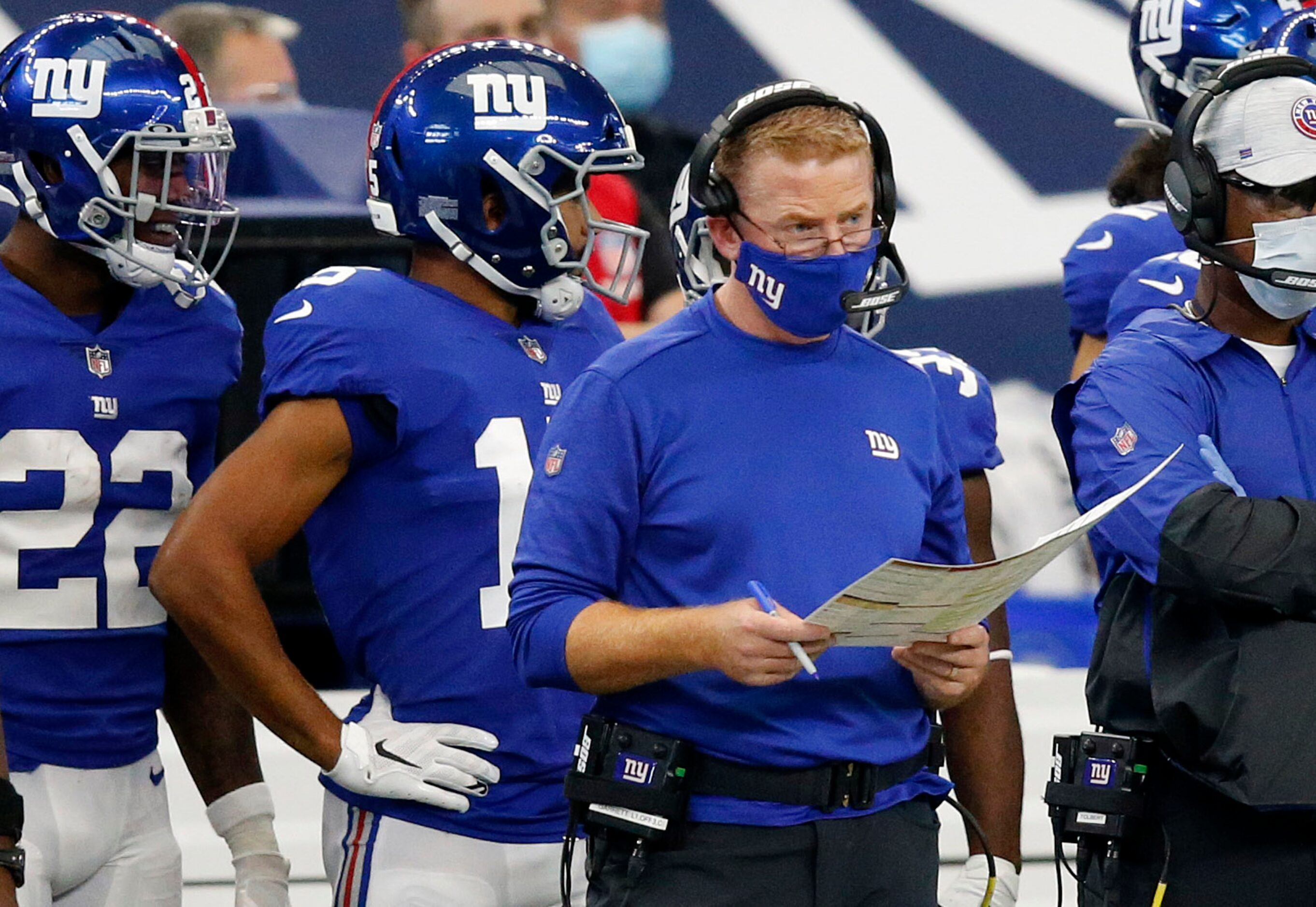 New York Giants offensive coordinator Jason Garrett calls the plays from the sidelines...