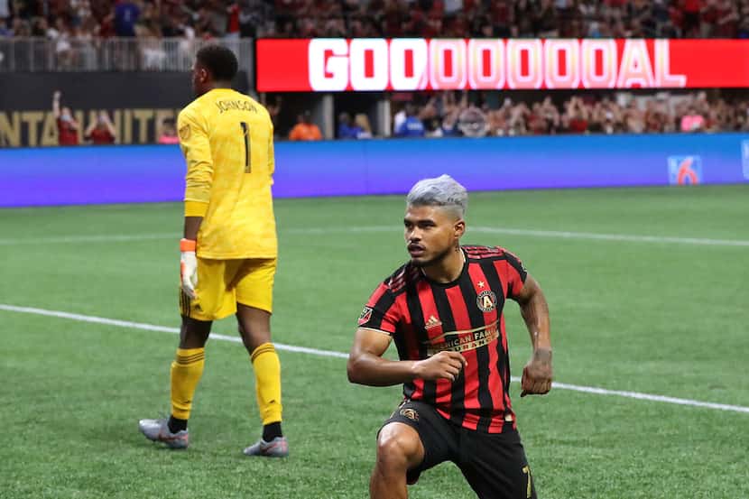 Atlanta United forward Josef Martinez strikes a victory pose for the fans after making a...