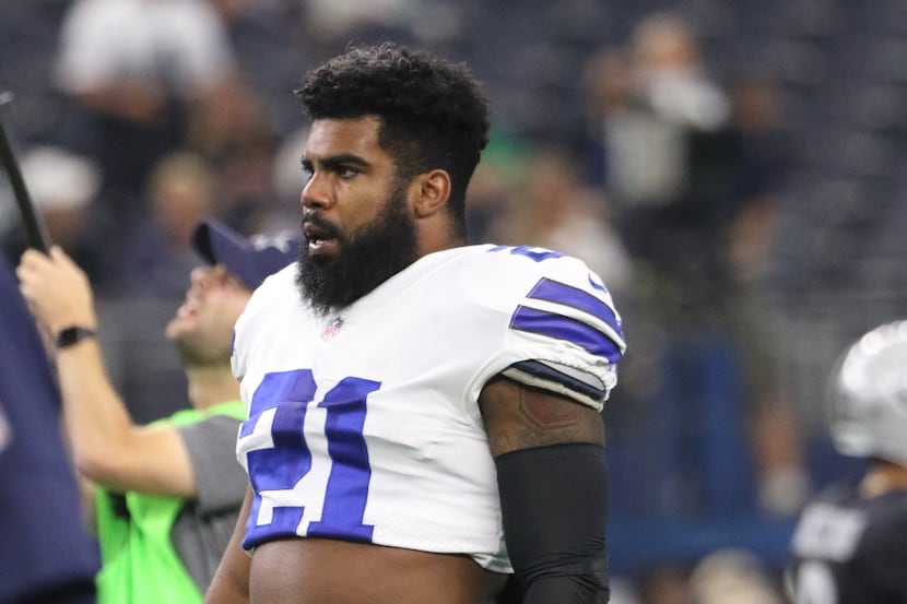 Dallas Cowboys Ezekiel Elliott (21) watches during warmups before the Dallas Cowboys vs...